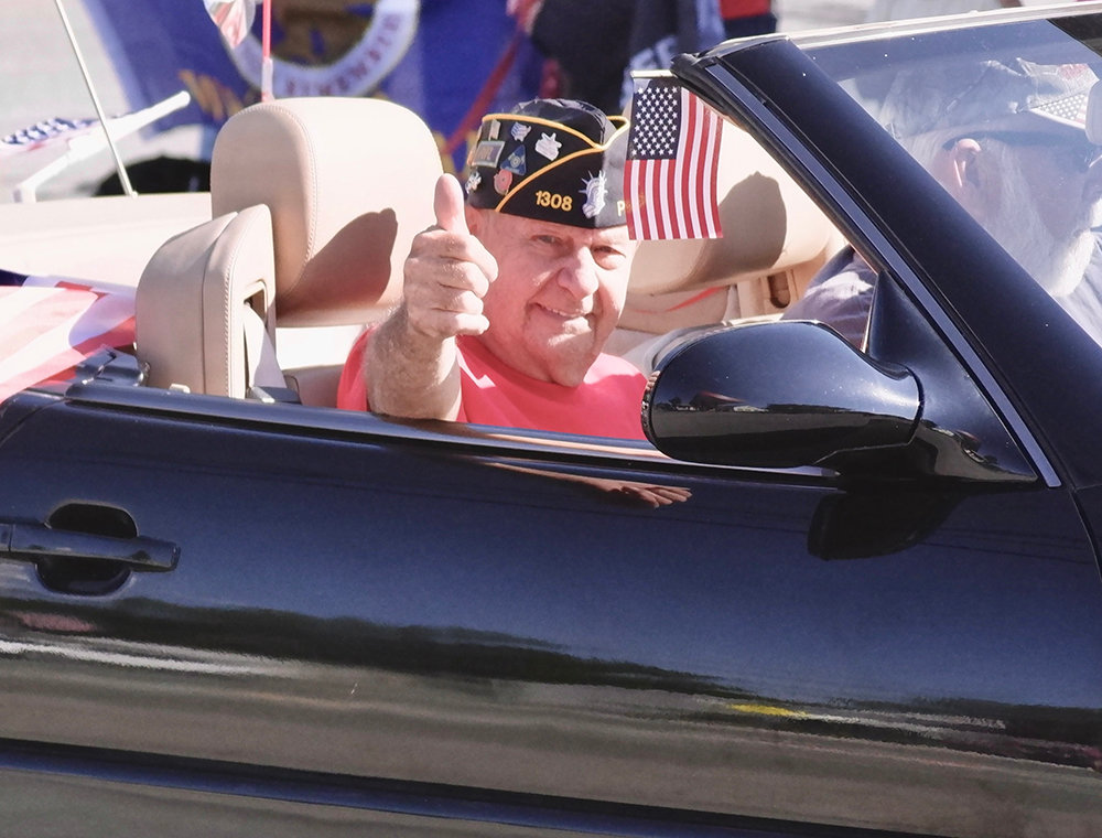 Don Bruyn of American Legion Post 1308 riding in style down Main Street
